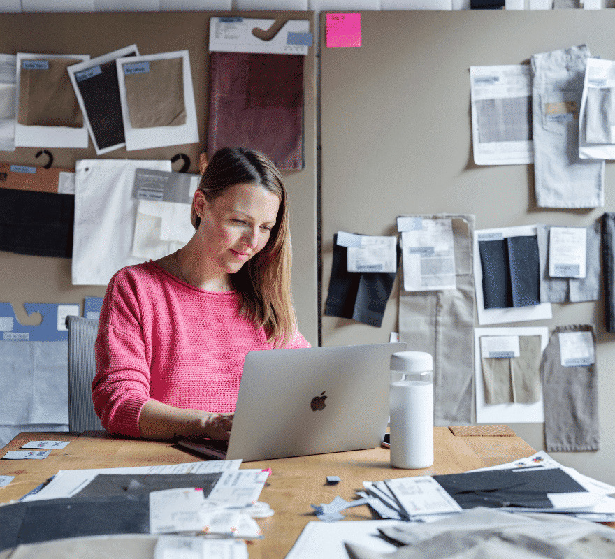 Fashion designer uses a MacBook for office work